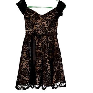 Kimcine black lace dress with tan lining. Removable ribbon belt. Medium
